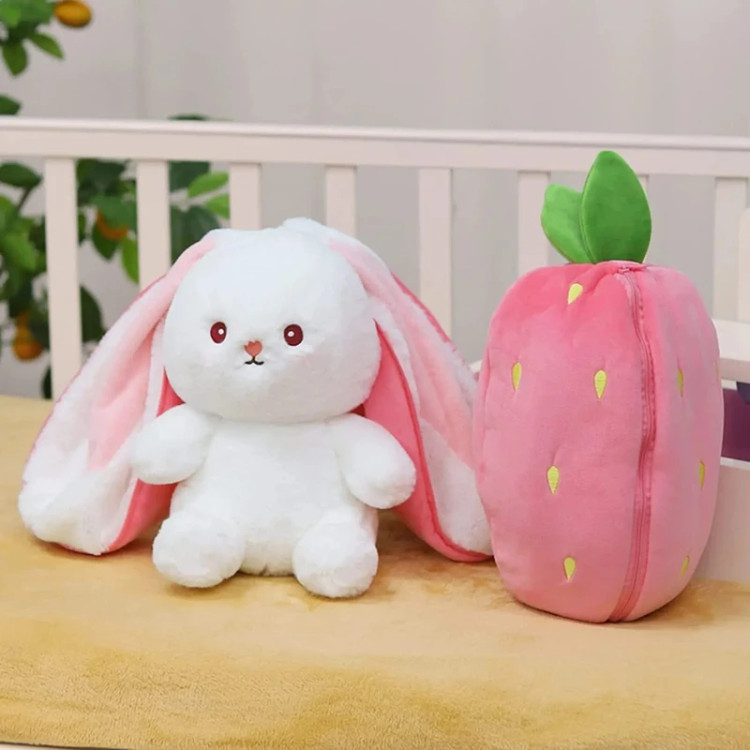 Close-up of bunny toy face with strawberry hat